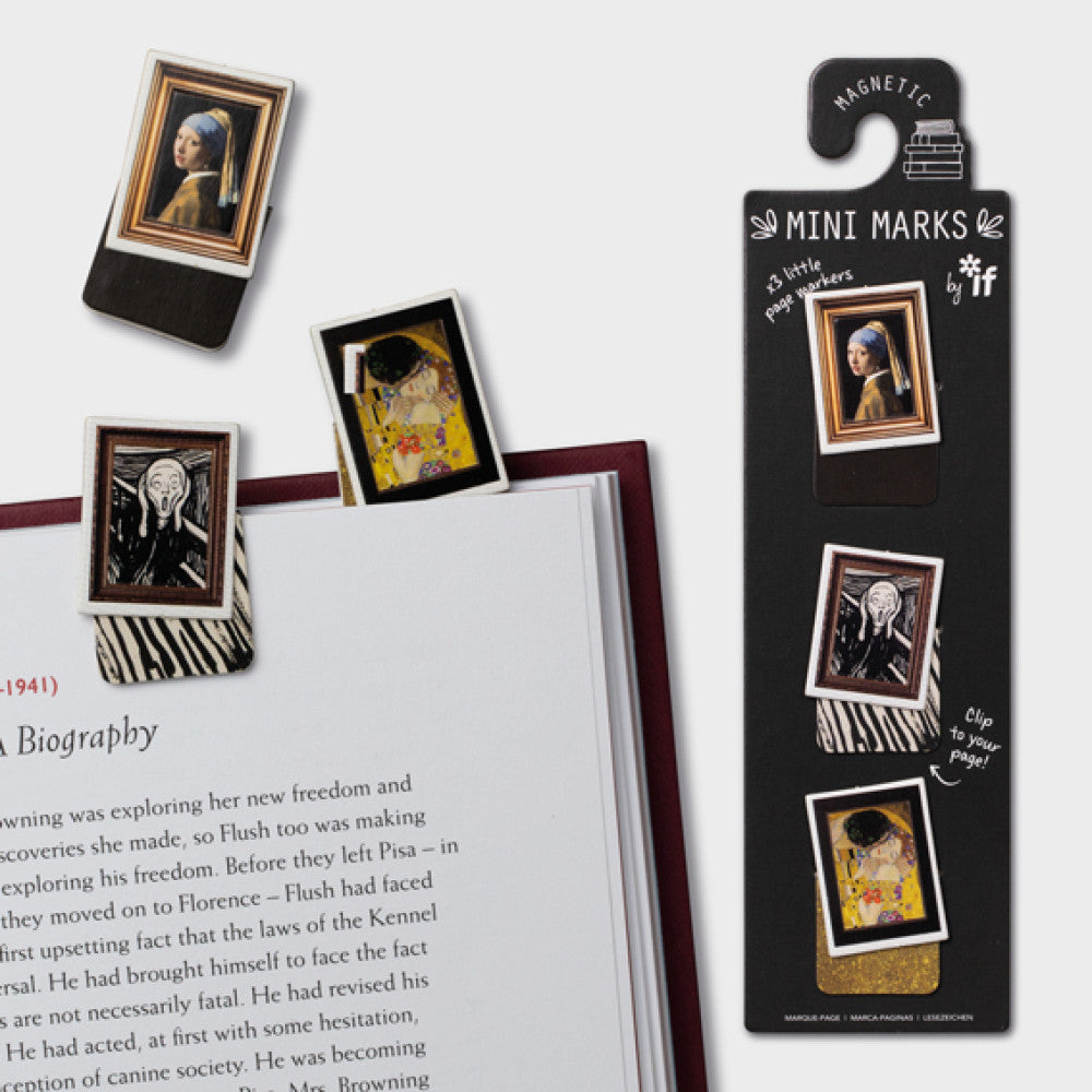 Magnetic mini marks with artistic designs on a book page